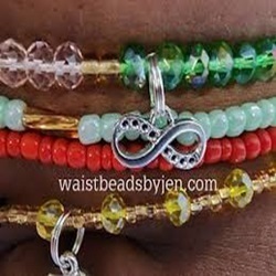 Five waistbeads with an Infinity charm, on a woman's belly
